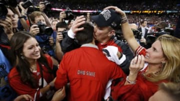 Jan 1, 2015; New Orleans, LA, USA; Ohio State Buckeyes head coach Urban Meyer kisses his son Nate as he celebrates with his family after the 2015 Sugar Bowl against the Alabama Crimson Tide at Mercedes-Benz Superdome. Ohio State defeated Alabama 42-35. Mandatory Credit: Matthew Emmons-USA TODAY Sports