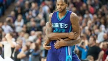 Jan 25, 2016; Sacramento, CA, USA; Charlotte Hornets guard Kemba Walker (15) celebrates with guard Troy Daniels (30) after Daniels made a three point shot against the Sacramento Kings in double overtime at Sleep Train Arena. The Charlotte Hornets defeated the Sacramento Kings 129-128 in double overtime. Mandatory Credit: Ed Szczepanski-USA TODAY Sports