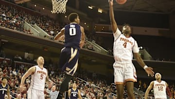 Jan 30, 2016; Los Angeles, CA, USA; Southern California Trojans forward Chimezie Metu (4) grabs a rebound against Washington Huskies forward Marquese Chriss (0) during the game at Galen Center. Mandatory Credit: Richard Mackson-USA TODAY Sports