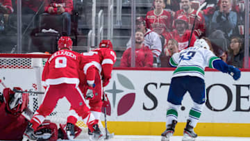 DETROIT, MI - OCTOBER 22: Bo Horvat #53 of the Vancouver Canucks scores a third period goal past goaltender Jimmy Howard #35, Justin Abdelkader #8 and Trevor Daley #83 of the Detroit Red Wings during an NHL game at Little Caesars Arena on October 22, 2019 in Detroit, Michigan. (Photo by Dave Reginek/NHLI via Getty Images)
