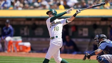 OAKLAND, CA - MAY 25: Chad Pinder #18 of the Oakland Athletics hits a two run rbi double against the Seattle Mariners in the bottom of the fourth inning of a Major League Baseball game at Oakland-Alameda County Coliseum on May 25, 2019 in Oakland, California. (Photo by Thearon W. Henderson/Getty Images)