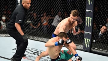 MEXICO CITY, MEXICO - AUGUST 05: (R-L) Dustin Ortiz punches Hector Sandoval of Mexico in their flyweight bout during the UFC Fight Night event at Arena Ciudad de Mexico on August 5, 2017 in Mexico City, Mexico. (Photo by Jeff Bottari/Zuffa LLC/Zuffa LLC via Getty Images)