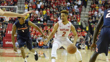 Mar 3, 2016; College Park, MD, USA; Maryland Terrapins guard Melo Trimble (2) makes a move to the basket as Illinois Fighting Illini guard Jaylon Tate (1) defends during the second half at Xfinity Center. Maryland Terrapins defeated Illinois Fighting Illini 81-55. Mandatory Credit: Tommy Gilligan-USA TODAY Sports