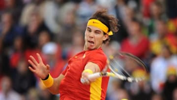SEVILLE, SPAIN - DECEMBER 04: Rafael Nadal of Spain plays a backhand to Juan Martin del Potro of Argentina during the third and last day of the final Davis Cup match between Spain and Argentina on December 4, 2011 in Seville, Spain. (Photo by Jasper Juinen/Getty Images)