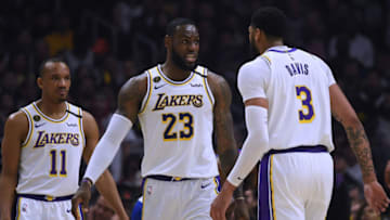 LOS ANGELES, CALIFORNIA - MARCH 08: LeBron James #23 of the Los Angeles Lakers reacts between Avery Bradley #11 and Anthony Davis #3 during a 112-103 win over the LA Clippers at Staples Center on March 08, 2020 in Los Angeles, California. NOTE TO USER: User expressly acknowledges and agrees that, by downloading and or using this photograph, User is consenting to the terms and conditions of the Getty Images License Agreement. (Photo by Harry How/Getty Images)