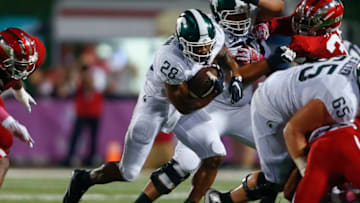 BLOOMINGTON, IN - OCTOBER 1: Madre London #28 of the Michigan State Spartans runs the ball against the Indiana Hoosiers at Memorial Stadium on October 1, 2016 in Bloomington, Indiana. (Photo by Michael Hickey/Getty Images)