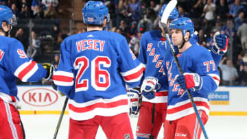 NEW YORK, NY - JANUARY 15: Tony DeAngelo #77 of the New York Rangers celebrates with teammates after scoring a goal in the third period against the Carolina Hurricanes at Madison Square Garden on January 15, 2019 in New York City. (Photo by Jared Silber/NHLI via Getty Images)