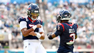 Sep 24, 2023; Jacksonville, Florida, USA; Houston Texans quarterback CJ Stroud (7) celebrates a touchdown with wide receiver Tank Dell (3) during the first half against the Jacksonville Jaguars at EverBank Stadium. Mandatory Credit: Melina Myers-USA TODAY Sports