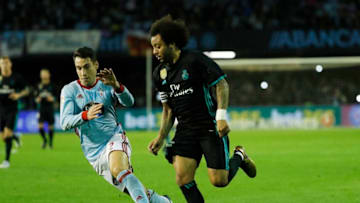VIGO, SPAIN - JANUARY 07: Marcelo of Real Madrid and Hugo Mallo of Celta Vigo battle for the ball during the La Liga match between Celta de Vigo and Real Madrid at Estadio de Balaidos on January 7, 2018 in Vigo, Spain. (Photo by TF-Images/TF-Images via Getty Images)