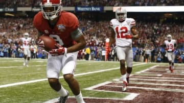 Jan 1, 2015; New Orleans, LA, USA; Alabama Crimson Tide wide receiver Amari Cooper (9) scores a touchdown during the first quarter against the Ohio State Buckeyes in the 2015 Sugar Bowl at Mercedes-Benz Superdome. Mandatory Credit: Matthew Emmons-USA TODAY Sports