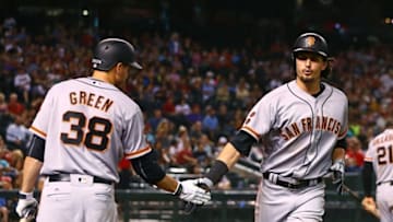Jul 1, 2016; Phoenix, AZ, USA; San Francisco Giants outfielder Jarrett Parker (right) is congratulated by Grant Green after hitting a solo home run in the eighth inning against the Arizona Diamondbacks at Chase Field. Mandatory Credit: Mark J. Rebilas-USA TODAY Sports
