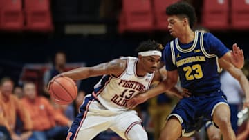 CHAMPAIGN, IL - JANUARY 11: Tracy Abrams #13 of the Illinois Fighting Illini dribbles the ball against Ibi Watson #23 of the Michigan Wolverines at State Farm Center on January 11, 2017 in Champaign, Illinois. (Photo by Michael Hickey/Getty Images)