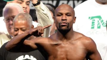 Sep 12, 2014; Las Vegas, NV, USA; Floyd Mayweather on the scale during the the weigh-in for his WBC Superwelter weight title fight against Marcos Maidana (not pictured) at the MGM Grand Garden Arena. Mandatory Credit: Jayne Kamin-Oncea-USA TODAY Sports