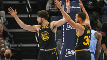 Jan 11, 2022; Memphis, Tennessee, USA; Golden State Warriors guards Klay Thompson (11) and Stephen Curry (30) react after a foul call during the first half against the Memphis Grizzles at FedExForum. Mandatory Credit: Petre Thomas-USA TODAY Sports
