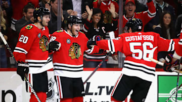 CHICAGO, IL - OCTOBER 23: Patrick Kane #88 of the Chicago Blackhawks (center) celebrates his third period goal with Brandon Saad #20 and Erik Gustafsson #56 against the Anaheim Ducks at the United Center on October23, 2018 in Chicago, Illinois. The Blackhawks defeated the Ducks 3-1. (Photo by Jonathan Daniel/Getty Images)