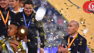 Real Madrid's French coach Zinedine Zidane (R) claps for his players after winning the Spanish Super Cup final between Real Madrid and Atletico Madrid on January 12, 2020, at the King Abdullah Sports City in the Saudi Arabian port city of Jeddah. (Photo by Giuseppe CACACE / AFP) (Photo by GIUSEPPE CACACE/AFP via Getty Images)