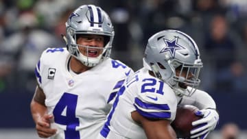 ARLINGTON, TX - DECEMBER 24: Dak Prescott #4 of the Dallas Cowboys hands the ball off to Ezekiel Elliott #21 of the Dallas Cowboys in the first quarter of a football game against the Seattle Seahawks at AT&T Stadium on December 24, 2017 in Arlington, Texas. (Photo by Tom Pennington/Getty Images)
