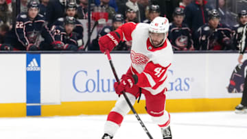COLUMBUS, OHIO - OCTOBER 16: Shayne Gostisbehere #41 of the Detroit Red Wings shoots the puck during the first period against the Columbus Blue Jackets at Nationwide Arena on October 16, 2023 in Columbus, Ohio. (Photo by Jason Mowry/Getty Images)