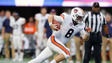 Jarrett Stidham was credited with 11 rushing attempts vs. Washington. (Photo by Kevin C. Cox/Getty Images)