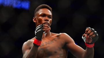 Mar 7, 2020; Las Vegas, Nevada, USA; Israel Adesanya (red gloves) before the match against Yoel Romero (blue gloves) during UFC 248 at T-Mobile Arena. Mandatory Credit: Stephen R. Sylvanie-USA TODAY Sports