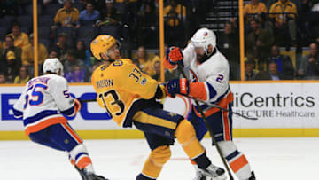 NASHVILLE, TN - OCTOBER 28: New York Islanders defenseman Nick Leddy (2) checks Nashville Predators right wing Viktor Arvidsson (33) off the puck during the NHL game between the Nashville Predators and the New York Islanders, held on October 28, 2017, at Bridgestone Arena in Nashville, Tennessee. (Photo by Danny Murphy/Icon Sportswire via Getty Images)