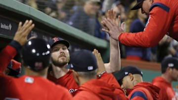 BOSTON, MA - OCTOBER 05: Chris Sale #41 of the Boston Red Sox is congratulated in the dugout after being relieved in the sixth inning of Game One of the American League Division Series against the New York Yankees at Fenway Park on October 5, 2018 in Boston, Massachusetts. (Photo by Elsa/Getty Images)