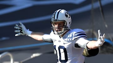 Dec 22, 2014; Miami, FL, USA; Brigham Young Cougars wide receiver Mitch Mathews (10) celebrates his touchdown against Memphis Tigers during the first quarter in the Miami Beach Bowl at Marlins Park. Mandatory Credit: Steve Mitchell-USA TODAY Sports