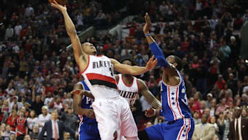 Mar 26, 2016; Portland, OR, USA; Portland Trail Blazers guard C.J. McCollum (3) shoots the game-winning shot and was fouled by Philadelphia 76ers forward Robert Covington (33) at Moda Center at the Rose Quarter. Portland won 108-105. Mandatory Credit: Jaime Valdez-USA TODAY Sports