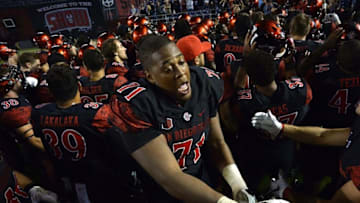 Oct 23, 2015; San Diego, CA, USA; San Diego State Aztecs offensive lineman Pearce Slater (71) celebrates with teammates after defeating the Utah State Aggies 48-14 at Qualcomm Stadium. Mandatory Credit: Jake Roth-USA TODAY Sports