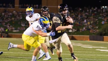 Sep 17, 2016; Winston-Salem, NC, USA; Wake Forest Demon Deacons defensive back Amari Henderson (10) runs in for a touchdown in the third quarter against the Delaware Fightin Blue Hens at BB&T Field. Wake defeated Delaware 38-21. Mandatory Credit: Jeremy Brevard-USA TODAY Sports