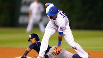 Sep 23, 2015; Chicago, IL, USA; Milwaukee Brewers shortstop Jean Segura (9) steals second under the tag of Chicago Cubs second baseman Addison Russell (22) during the fifth inning at Wrigley Field. Mandatory Credit: Dennis Wierzbicki-USA TODAY Sports
