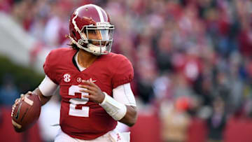 Nov 26, 2016; Tuscaloosa, AL, USA; Alabama Crimson Tide quarterback Jalen Hurts (2) scrambles out of the pocket against the Auburn Tigers during the second quarter at Bryant-Denny Stadium. Mandatory Credit: John David Mercer-USA TODAY Sports