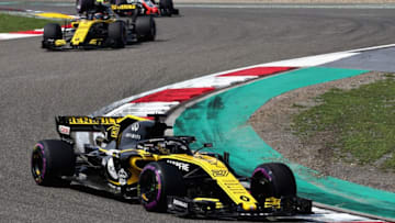SHANGHAI, CHINA - APRIL 15: Nico Hulkenberg of Germany driving the (27) Renault Sport Formula One Team RS18 leads Carlos Sainz of Spain driving the (55) Renault Sport Formula One Team RS18 (Photo by Mark Thompson/Getty Images)