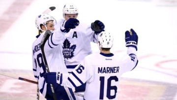 Dec 28, 2016; Sunrise, FL, USA; Toronto Maple Leafs center Mitch Marner (16) celebrates his game winning goal with right wing William Nylander (29) and defenseman Morgan Rielly in a shoot out against the Florida Panthers at BB&T Center. The Maple Leafs won 3-2. Mandatory Credit: Robert Mayer-USA TODAY Sports