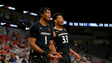 Cincinnati Bearcats players Kalu Ezikpe and Ody Oguama during game against Houston Cougars at Dickies Arena. USA Today.