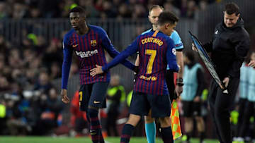Barcelona's Brazilian midfielder Philippe Coutinho (C) greets Barcelona's French forward Ousmane Dembele (L). (Photo credit LLUIS GENE/AFP via Getty Images)