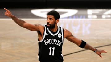 NEW YORK, NEW YORK - JANUARY 01: Kyrie Irving #11 of the Brooklyn Nets points (Photo by Sarah Stier/Getty Images)