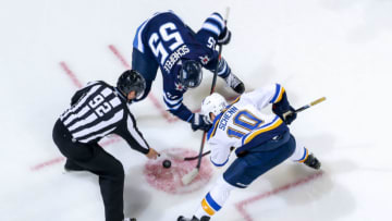 WINNIPEG, MB - OCTOBER 22: Mark Scheifele #55 of the Winnipeg Jets takes a second period face-off against Brayden Schenn #10 of the St. Louis Blues at the Bell MTS Place on October 22, 2018 in Winnipeg, Manitoba, Canada. (Photo by Jonathan Kozub/NHLI via Getty Images)