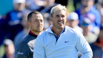 PONTE VEDRA BEACH, FLORIDA - MARCH 12: Brooks Koepka of The United States plays his tee shot on the par 4, 18th hole during the rain delayed completion of the second round of THE PLAYERS Championship at TPC Sawgrass on March 12, 2022 in Ponte Vedra Beach, Florida. (Photo by David Cannon/Getty Images)