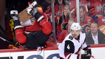 Mar 11, 2016; Calgary, Alberta, CAN; Calgary Flames center Lance Bouma (17) goes over the boards after a check on Arizona Coyotes defenseman Zbynek Michalek (4) during the second period at Scotiabank Saddledome. Mandatory Credit: Candice Ward-USA TODAY Sports