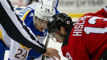 Oct 23, 2021; Newark, New Jersey, USA; Buffalo Sabres center Dylan Cozens (24) and New Jersey Devils center Nico Hischier (13) await the puck drop during the first period at Prudential Center. Mandatory Credit: Tom Horak-USA TODAY Sports
