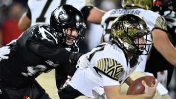 Nov 12, 2016; Louisville, KY, USA; Louisville Cardinals linebacker James Hearns (99) sacks Wake Forest Demon Deacons quarterback John Wolford (10) during the second half at Papa John