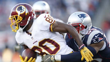 Nov 8, 2015; Foxborough, MA, USA; Washington Redskins wide receiver Jamison Crowder (80) is tackled by New England Patriots middle linebacker Jonathan Freeny (55) during the fourth quarter at Gillette Stadium. The New England Patriots won 27-10. Mandatory Credit: Greg M. Cooper-USA TODAY Sports