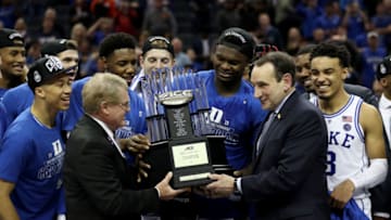 CHARLOTTE, NORTH CAROLINA - MARCH 16: Head coach Mike Krzyzewski of the Duke Blue Devils accepts the ACC Championship trophy after defeating the Florida State Seminoles 73-63 in the championship game of the 2019 Men's ACC Basketball Tournament at Spectrum Center on March 16, 2019 in Charlotte, North Carolina. (Photo by Streeter Lecka/Getty Images)