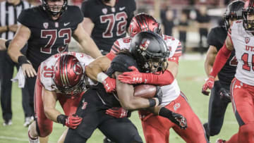 PALO ALTO, CA - OCTOBER 6: Trevor Speights #23 of the Stanford Cardinal is tackled by Francis Bernard #36 and Cody Barton #30 of the Utah Utes during an NCAA Pac-12 college football game on October 6, 2018 at Stanford Stadium in Palo Alto, California. (Photo by David Madison/Getty Images)