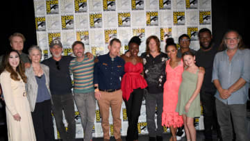 SAN DIEGO, CALIFORNIA - JULY 22: (L-R) Angela Kang, Josh McDermitt, Melissa McBride, Andrew Lincoln, Chris Hardwick, Scott M. Gimple, Danai Gurira, Norman Reedus, Lauren Ridloff, Seth Gilliam, Cailey Fleming, Michael James Shaw, and Greg Nicotero pose during AMC's "The Walking Dead" panel during 2022 Comic-Con International: San Diego at San Diego Convention Center on July 22, 2022 in San Diego, California. (Photo by Albert L. Ortega/Getty Images)