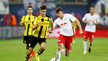 LEIPZIG, GERMANY - SEPTEMBER 10: Oliver Jason Burke (R) of Leipzig battles for the ball with Julian Weigl of Dortmund during the Bundesliga match between RB Leipzig and Borussia Dortmund at Red Bull Arena on September 10, 2016 in Leipzig, Germany. (Photo by Alexander Hassenstein/Bongarts/Getty Images)