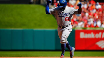 ST. LOUIS, MO - SEPTEMBER 15: Yasiel Puig #66 of the Los Angeles Dodgers celebrates after hitting a three-run home run against the St. Louis Cardinals in the fifth inning at Busch Stadium on September 15, 2018 in St. Louis, Missouri. (Photo by Dilip Vishwanat/Getty Images)