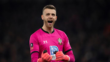 LONDON, ENGLAND - FEBRUARY 05: Goalkeeper Angus Gunn celebrates as Southampton equalise during the FA Cup Fourth Round Replay match between Tottenham Hotspur and Southampton FC at Tottenham Hotspur Stadium on February 05, 2020 in London, England. (Photo by Visionhaus)