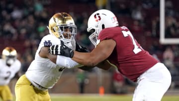 Notre Dame Fighting Irish defensive lineman Justin Ademilola (9) and Stanford Cardinal offensive tackle Walter Rouse (75) during the third quarter at Stanford Stadium. (Darren Yamashita-USA TODAY Sports)